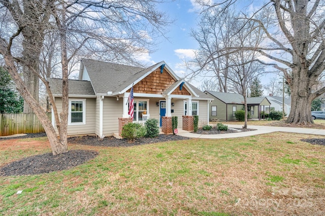 craftsman-style home with a front yard