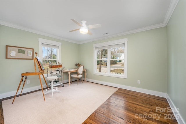 office area featuring crown molding, wood-type flooring, and ceiling fan