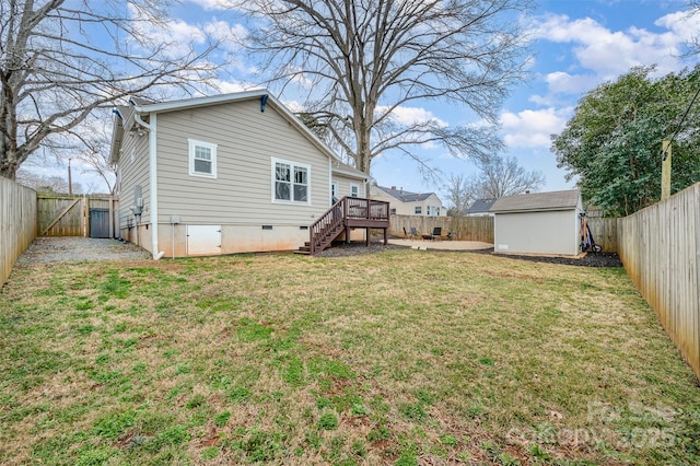 view of yard with a deck and a storage shed