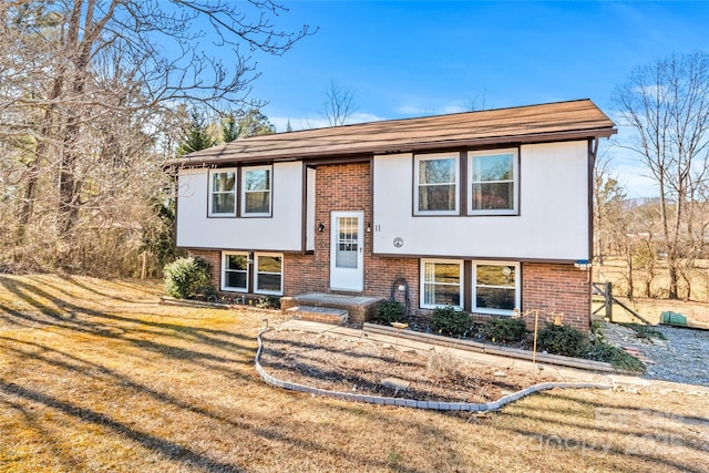 bi-level home featuring a front yard