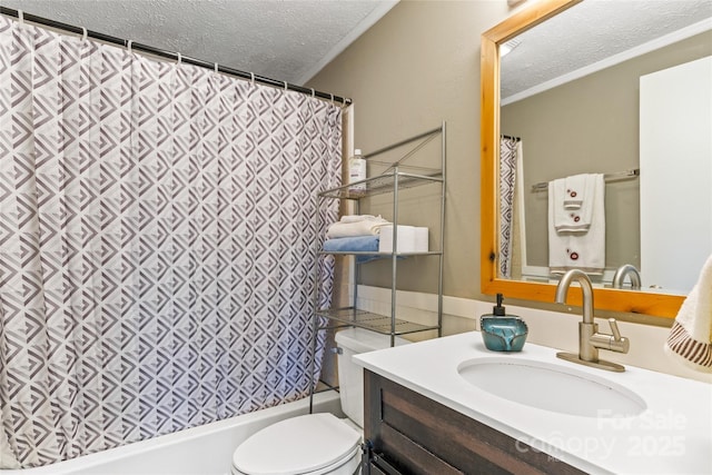 full bathroom featuring shower / bath combination with curtain, vanity, toilet, and a textured ceiling