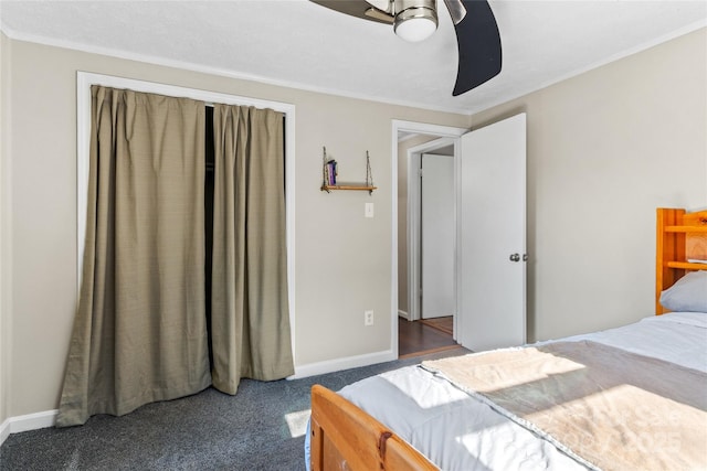 carpeted bedroom featuring ornamental molding and ceiling fan