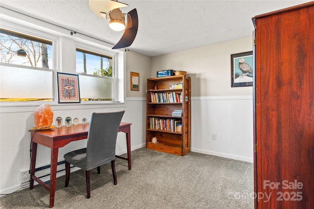 carpeted office featuring a baseboard radiator