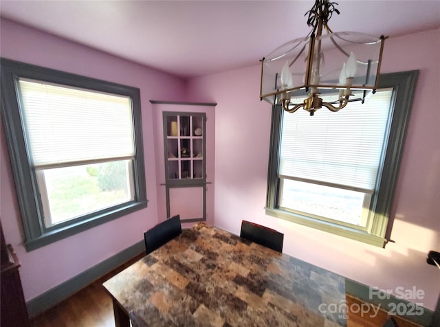 dining space with a chandelier