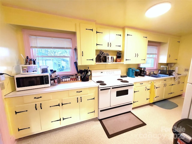 kitchen featuring sink and white appliances