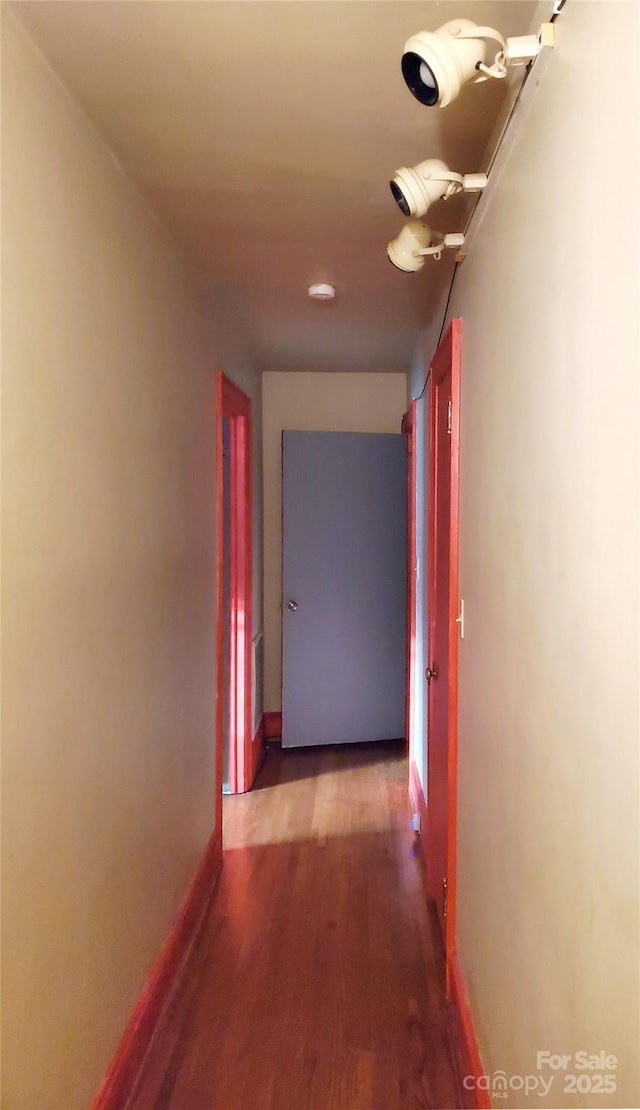 corridor featuring hardwood / wood-style floors