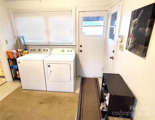 washroom with washing machine and clothes dryer