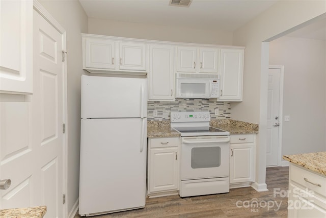 kitchen with backsplash, white cabinetry, and white appliances