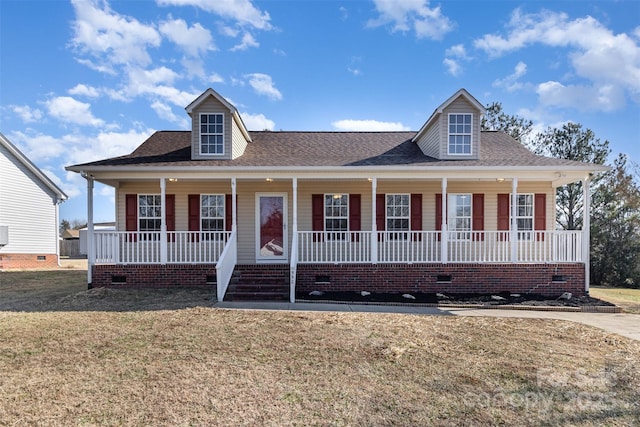 view of front facade with covered porch and a front lawn