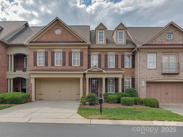 townhome / multi-family property featuring a garage