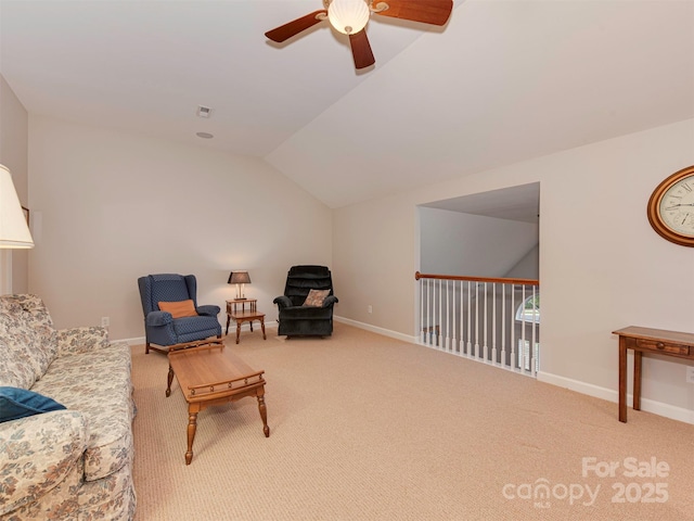 sitting room featuring vaulted ceiling, ceiling fan, and carpet flooring