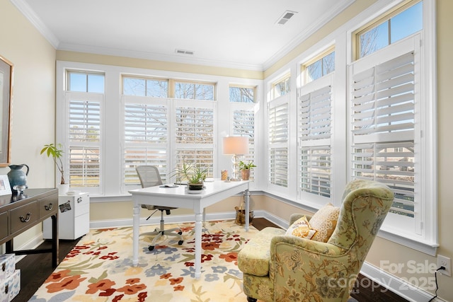 home office with crown molding and a wealth of natural light