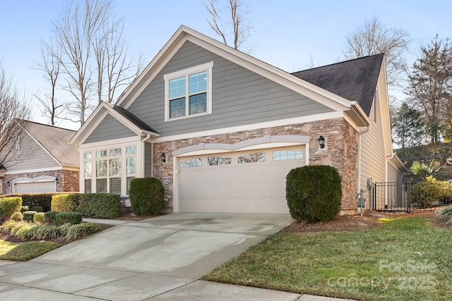 view of front of property featuring a garage and a front yard