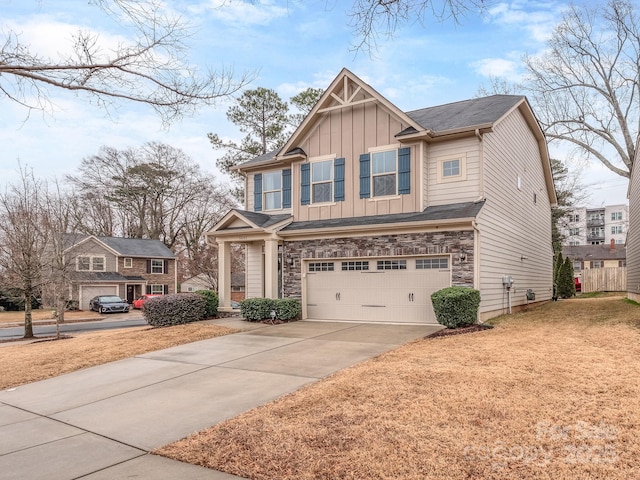 craftsman house with a garage and a front yard