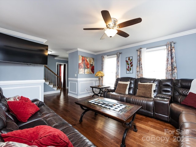 living room with crown molding, ceiling fan, and wood-type flooring