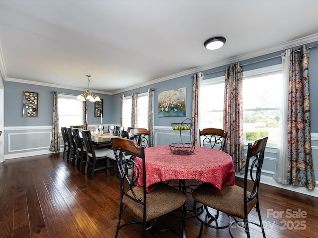 dining area with crown molding, dark hardwood / wood-style floors, and a healthy amount of sunlight