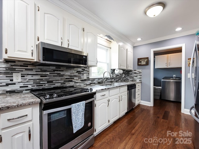 kitchen with crown molding, appliances with stainless steel finishes, sink, and white cabinets