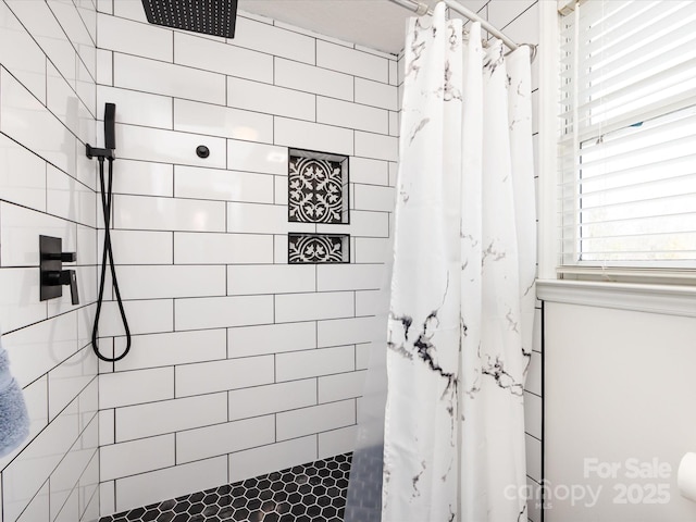 bathroom featuring curtained shower