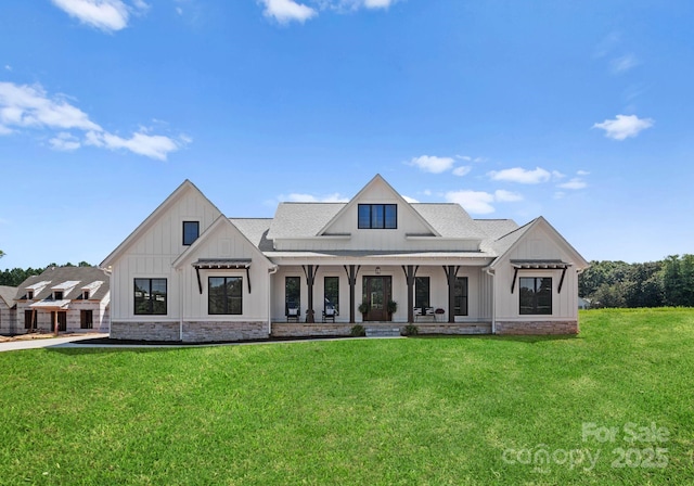 rear view of house with a yard