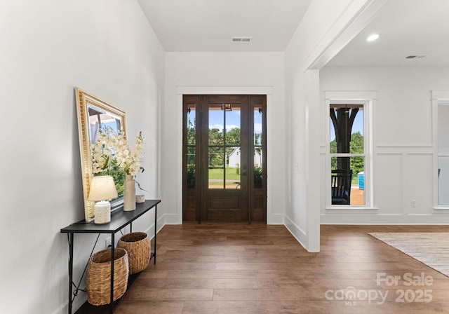 foyer entrance with dark wood-type flooring