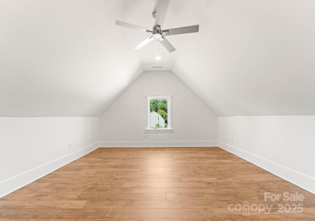 bonus room featuring lofted ceiling and light hardwood / wood-style flooring