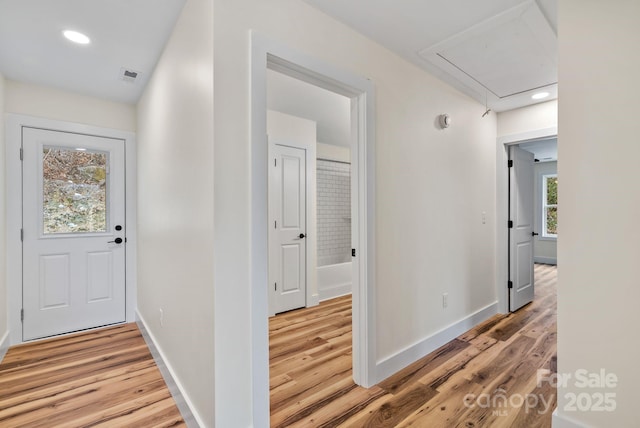 corridor featuring wood-type flooring