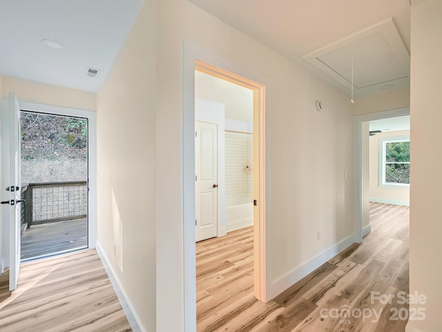 hall with light wood-type flooring