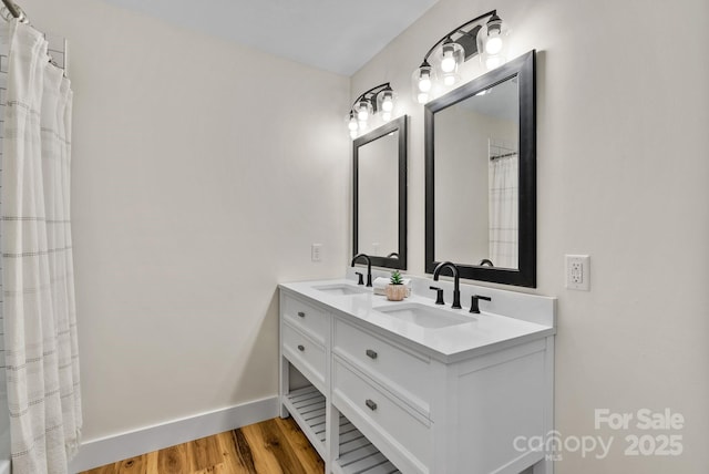 bathroom featuring hardwood / wood-style flooring and vanity