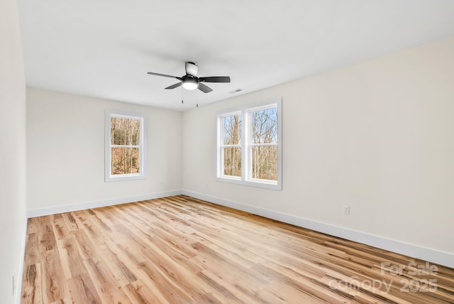 spare room with light hardwood / wood-style floors and ceiling fan