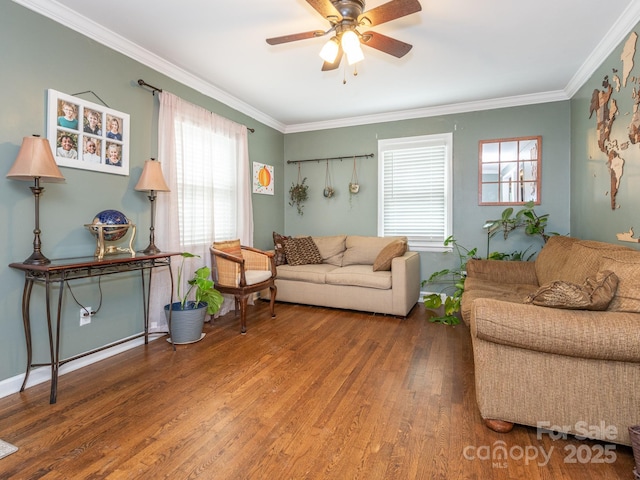 living room featuring ornamental molding, hardwood / wood-style floors, and ceiling fan