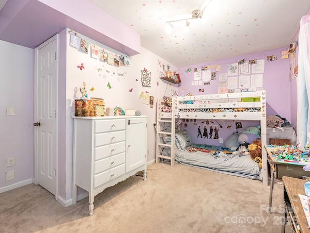 bedroom with light carpet