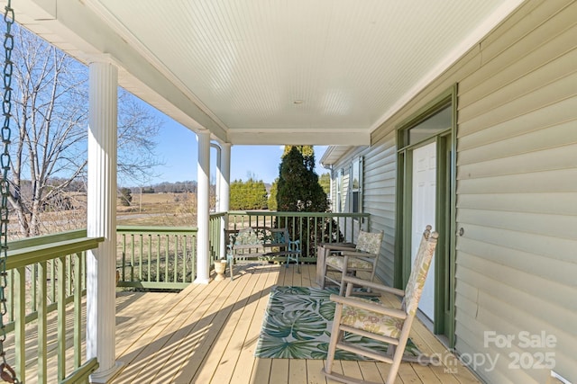 wooden deck featuring a porch