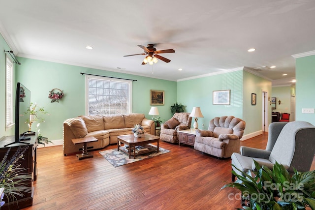 living room with crown molding, ceiling fan, and wood-type flooring