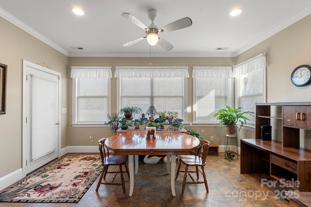 dining space with ornamental molding, plenty of natural light, and ceiling fan