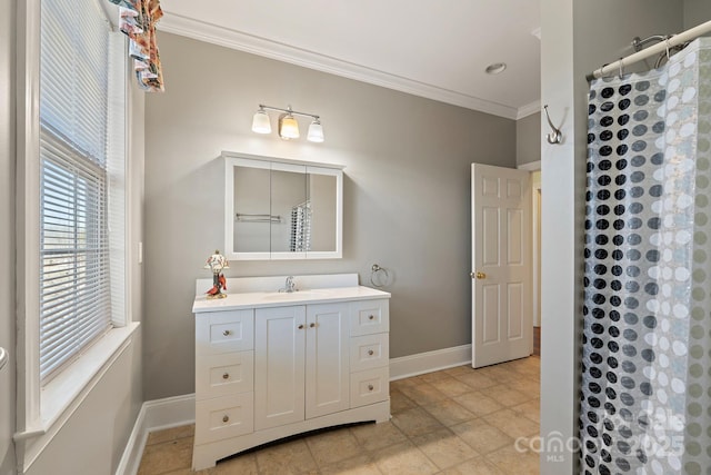 bathroom with vanity, crown molding, and a shower with curtain