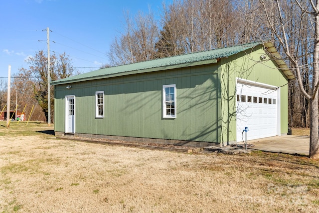 garage featuring a yard