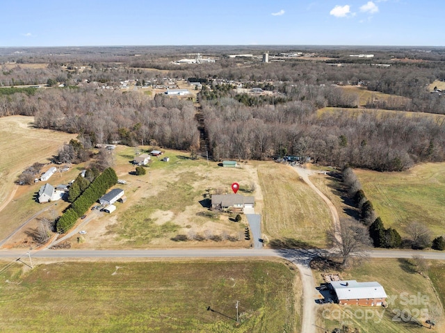 birds eye view of property with a rural view