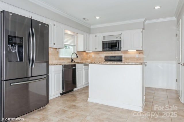 kitchen with ornamental molding, appliances with stainless steel finishes, and white cabinets