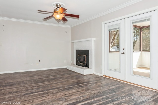 unfurnished living room with dark wood-style floors, baseboards, ornamental molding, and french doors