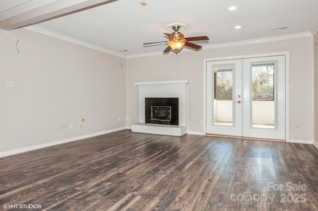 unfurnished living room with baseboards, ornamental molding, dark wood finished floors, and french doors