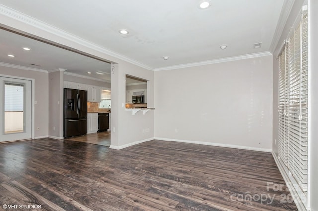 unfurnished living room with crown molding, baseboards, dark wood-style flooring, and recessed lighting