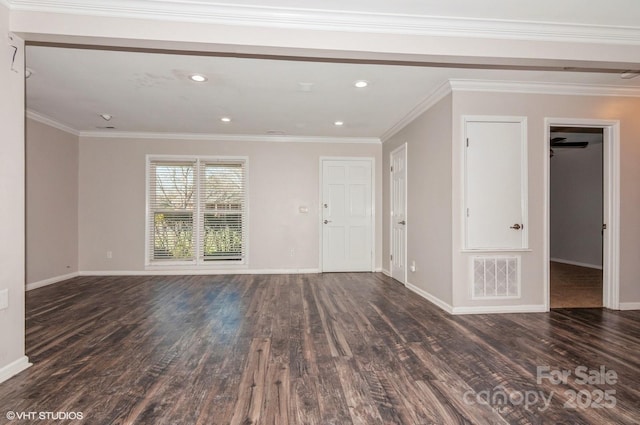 unfurnished living room featuring crown molding, dark wood-style flooring, visible vents, and baseboards