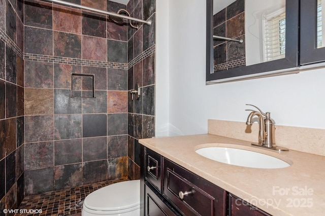 full bath with toilet, a shower stall, and vanity