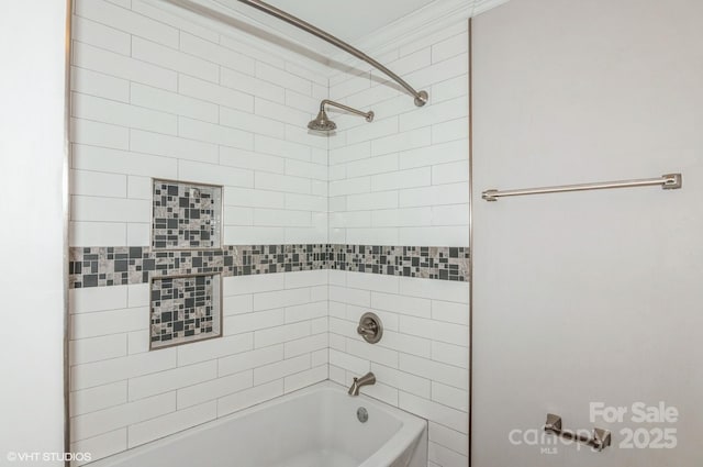 bathroom with ornamental molding and tub / shower combination