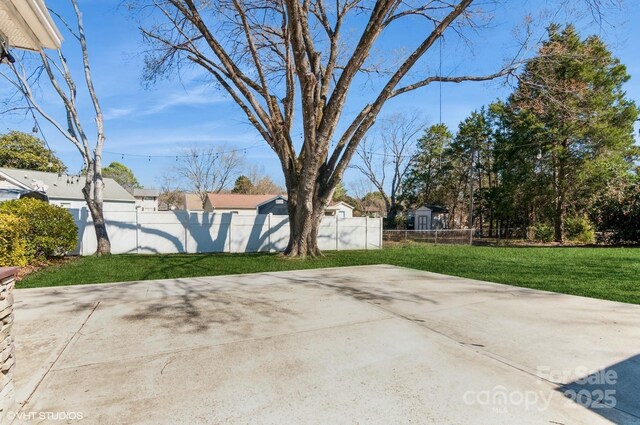 view of patio featuring fence