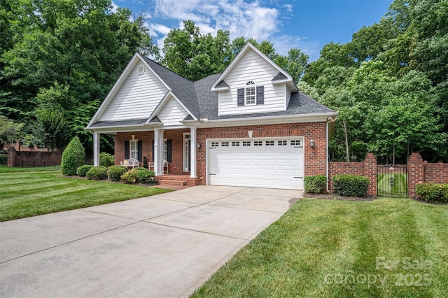 view of front of home with a porch, a garage, and a front yard