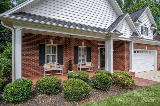 view of front of house with a garage and a porch