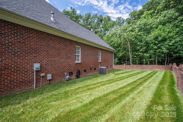 view of yard with central AC