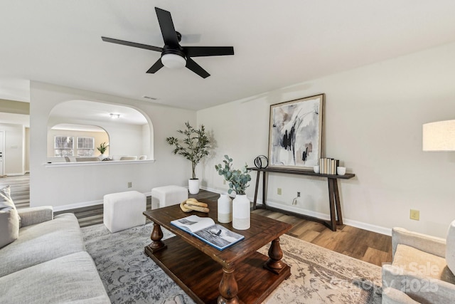 living room with ceiling fan and light hardwood / wood-style floors