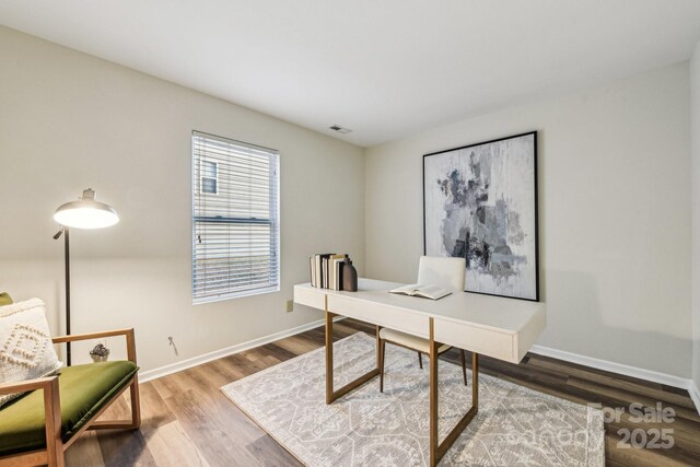 office space with hardwood / wood-style flooring